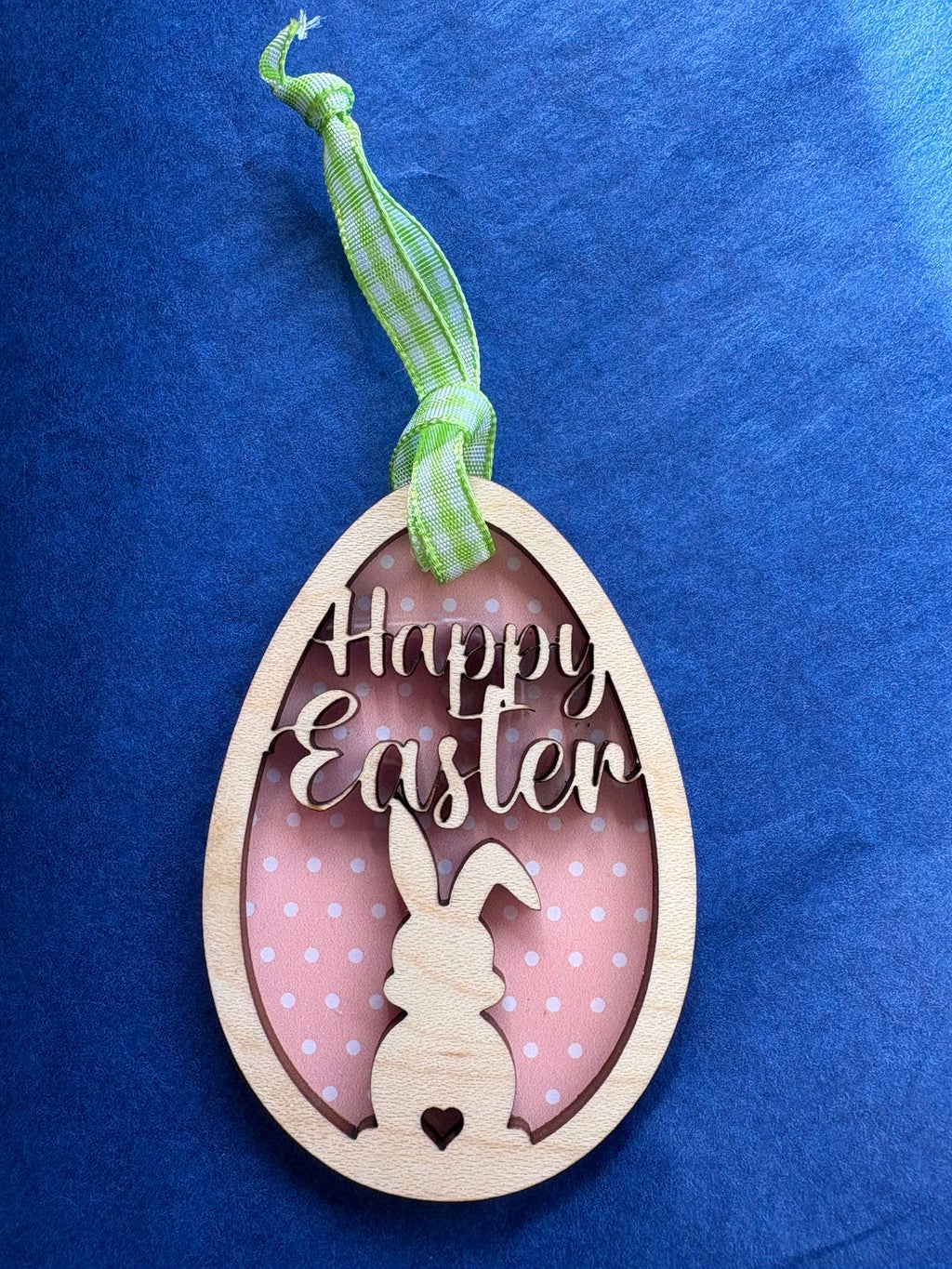 Happy Easter wooden hanging Decoration with a rabbit in the middle of an egg 