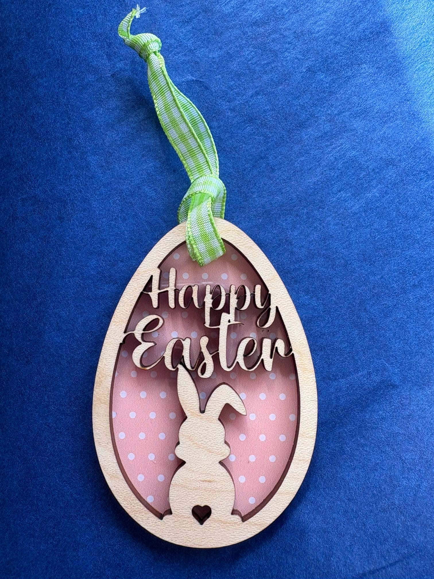 Happy Easter wooden hanging Decoration with a rabbit in the middle of an egg 