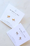 Bumble & Bee bow stud earrings on branded earring card – sterling silver and 18k gold plated options