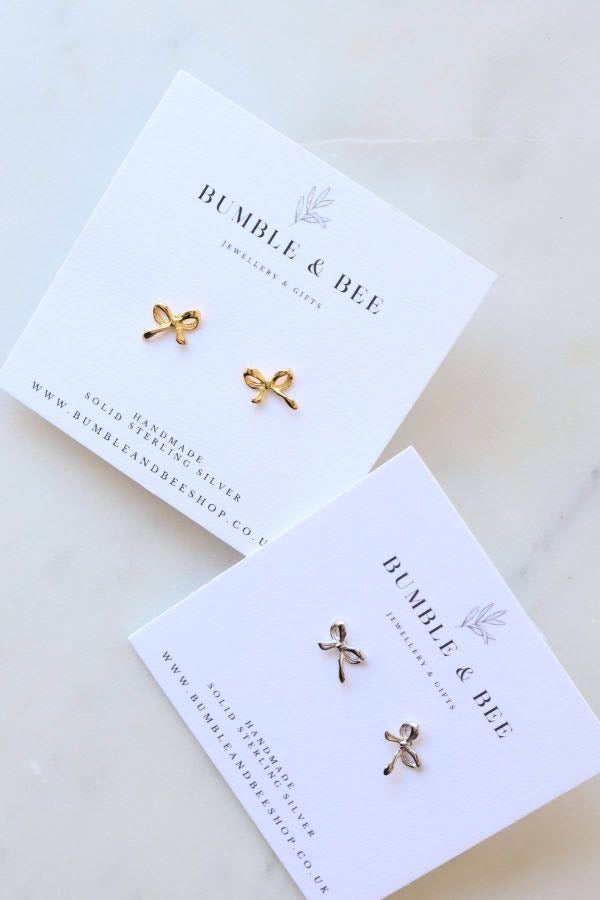 Bumble & Bee bow stud earrings on branded earring card – sterling silver and 18k gold plated options