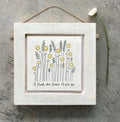 East of India small distressed whitewashed wooden framed picture with a wildflower and sunflower illustration and the sentiment "If friends were flowers I'd pick you," hung with natural jute twine string.