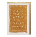 Funny birthday card with “Age is just a number. A big creaky number” text in book-style design