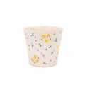 Small white floral ceramic plant pot with scalloped rim and hand-painted style flowers