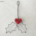 Rusty wire hanging red holly decoration from east of india