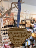Wooden teacup hanging decoration with ribbon engraved “You’re a tea-rific Granny”