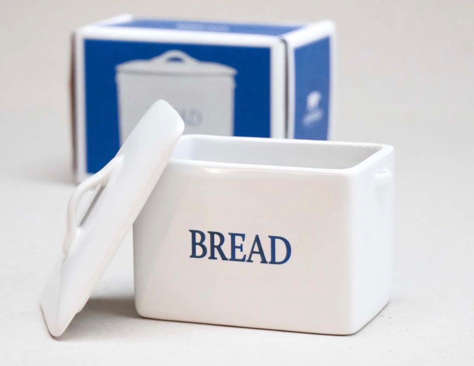 Cowfield Design mini white ceramic bread bin with lid and “BREAD” text