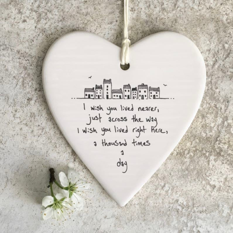 I wish you lived nearer, just across the way. I wish you lived right here, a thousand times a day' hanging heart