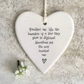 Families are like the branches of a tree they grow in different directions, yet the root remains one hanging heart