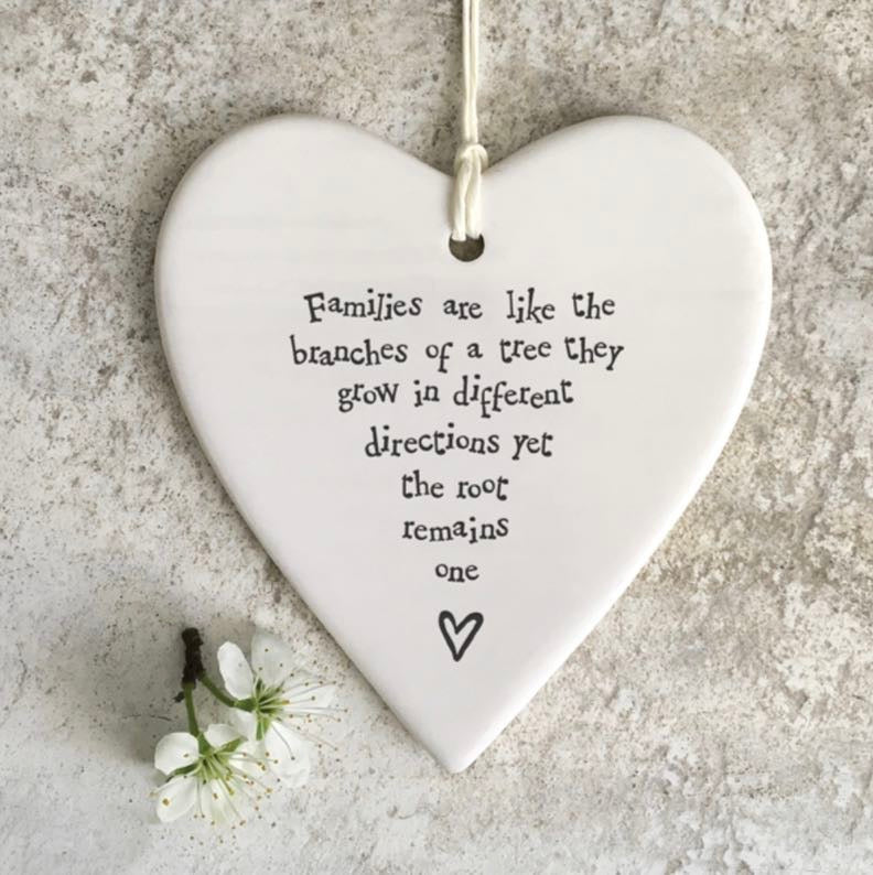 Families are like the branches of a tree they grow in different directions, yet the root remains one hanging heart